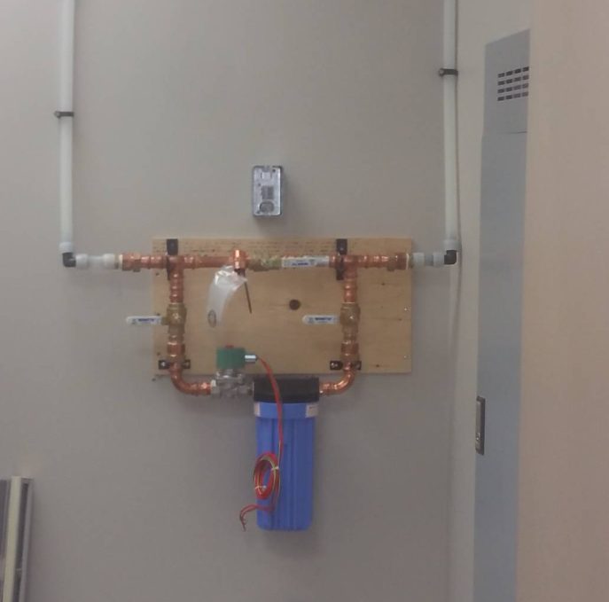 Neat copper manifold and water filter installed by Integrity Plumbing in Ottawa